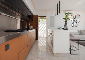 a kitchen with a stove and a counter top at White Pearl in Paphos City