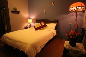 Giường trong phòng chung tại Heart Stay +8 ảnh