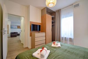 Posteľ alebo postele v izbe v ubytovaní Apartamenty Onyx SeaView by Rent like home