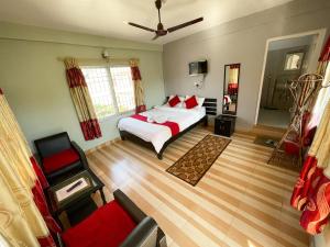 Llit o llits en una habitació de Harvest Moon Guest House