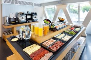 a buffet with many different types of food on display at Hotel Royal Passeig de Gracia in Barcelona +98 photos