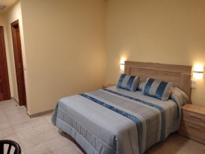 Posteľ alebo postele v izbe v ubytovaní Hotel Novo