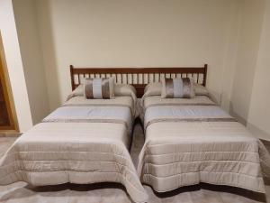Posteľ alebo postele v izbe v ubytovaní Hotel Novo