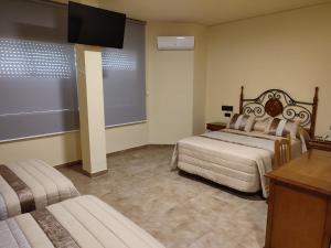 Posteľ alebo postele v izbe v ubytovaní Hotel Novo