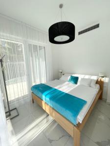 Tempat tidur dalam kamar di Spa Residence Carbona Royal Suites 1.11