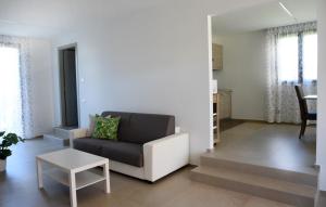 a living room with a couch and a table at Villa al Mare in Bellaria-Igea Marina