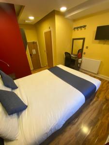 Postel nebo postele na pokoji v ubytování Ville Hotel