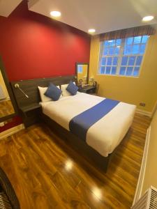Postel nebo postele na pokoji v ubytování Ville Hotel