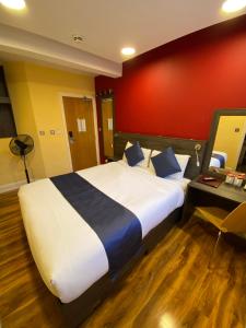 Postel nebo postele na pokoji v ubytování Ville Hotel