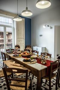 a dining room with a table with food on it at U'Panare in Taranto