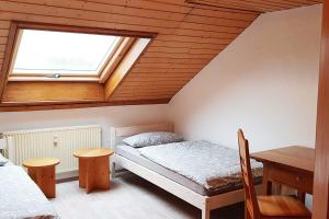 เตียงในห้องที่ Penthouse Apartment in Langenloh bei Nürnberg