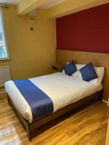 Postel nebo postele na pokoji v ubytování Ville Hotel