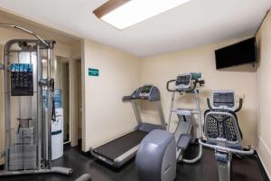 a gym with cardio equipment in a room at Days Inn by Wyndham Maui Oceanfront in Wailea