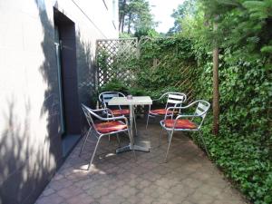 a table and chairs sitting on a patio at Apartament "Cudowna Wyspa" in Świnoujście
