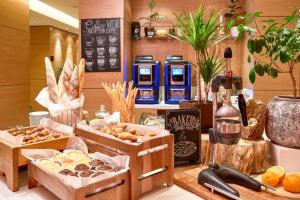 a bakery with several boxes of pastries on a counter at Radisson Blu Resort Bukovel in Bukovel