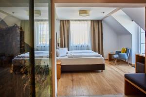 Voodi või voodid majutusasutuse Hotel Donauhof toas
