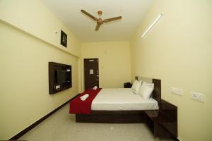 Voodi või voodid majutusasutuse Akash Residency toas