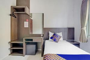 Krevet ili kreveti u jedinici u okviru objekta OYO 90777 D’river Guest House