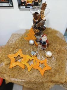 a table with a christmas ornament and a vase on it at Pension Waldesruh in Linz