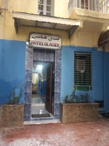 a blue building with a hotel clacer sign on it at Hôtel Glacier in Fez