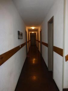 an empty hallway with a hallway leading into a room at GAUDISSARD A612 in Barcelonnette