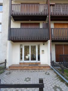 a house with a balcony on top of it at GAUDISSARD A612 in Barcelonnette