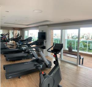 a gym with a bunch of exercise bikes in a room at Quality Porto Alegre in Porto Alegre