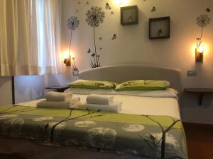 Postel nebo postele na pokoji v ubytování Notti Etrusche a Sovana