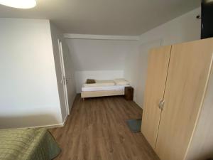 Postel nebo postele na pokoji v ubytování Pension Haus Talblick