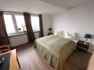 Postel nebo postele na pokoji v ubytování Pension Haus Talblick