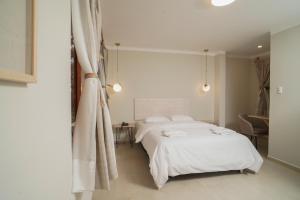 Cama o camas de una habitación en KANTU GARDEN LODGE
