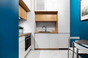 Kuchyňa alebo kuchynka v ubytovaní Elite Apartments Nadmotławie Prestige
