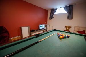 a room with a pool table with balls on it at Chalet 48 in Hermagor