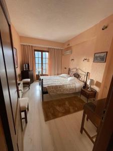 Krevet ili kreveti u jedinici u okviru objekta Olympic Hotel