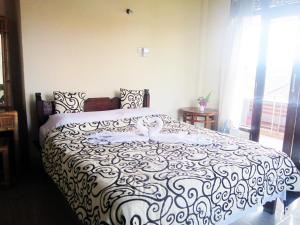 Postel nebo postele na pokoji v ubytování Tunjung Guest House