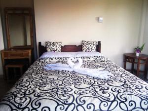 Postel nebo postele na pokoji v ubytování Tunjung Guest House