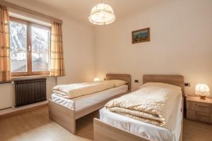 Postel nebo postele na pokoji v ubytování Appartamento Blank