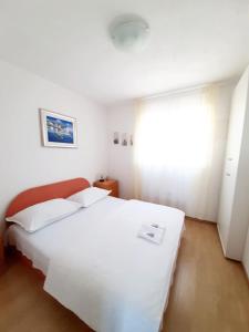 Posteľ alebo postele v izbe v ubytovaní Apartments Tomislav Mamic