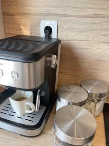 a coffee maker on a counter with a cup of coffee at Elegant Studio for 4 Persons in Center & Parking in Stara Zagora