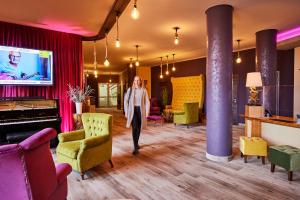TV a/nebo společenská místnost v ubytování Trihotel Rostock - Wellnesshotel Adults Only