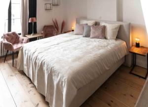 Postel nebo postele na pokoji v ubytování B&B landhuis Hauwaart 80