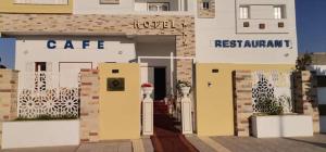 a rendering of a building with a cafe and a sign at Hotel al rayan in Tataouine