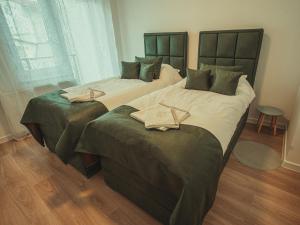Postel nebo postele na pokoji v ubytování APARTMANI INFINITY