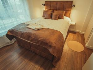 Postel nebo postele na pokoji v ubytování APARTMANI INFINITY