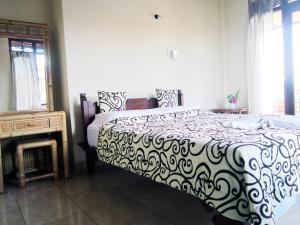 Postel nebo postele na pokoji v ubytování Tunjung Guest House