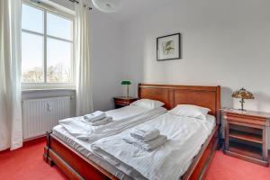 Łóżko lub łóżka w pokoju w obiekcie Dom & House - Apartments Parkur Sopot