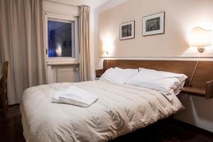 Letto o letti in una camera di Hotel Hermitage