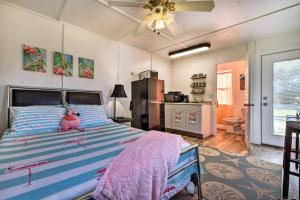 a bedroom with a bed with a pink stuffed animal on it at Flirty Flamingo Studio 1 Mi to Canyon Lake in Canyon Lake