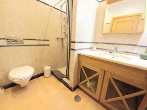 a bathroom with a shower and a toilet and a sink at Casa da Praia in Sagres +14 photos
