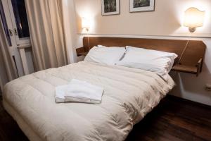 Letto o letti in una camera di Hotel Hermitage